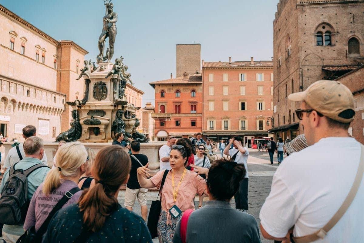 Bologna: Guided Walking Tour + Archiginnasio & Clock Tower Entry Piazza Maggiore and Fountain of Neptune