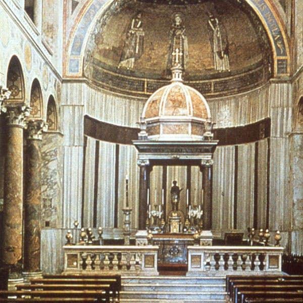 Catacombs of St. Agnes: Guided Tour Ornate church interior with an altar, adorned with candles and religious statues. Detailed dome with mosaics above the altar.